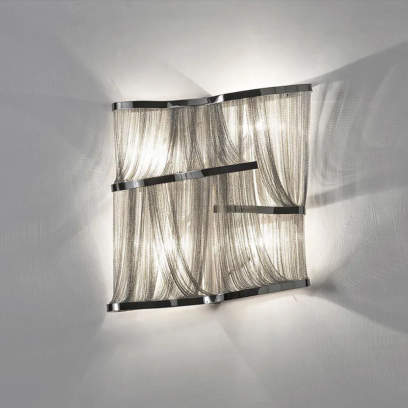 Boucle Iron Wall Sconce in polished chrome
